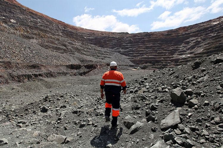 A Mineworker is Walking in a Diamond Mine 