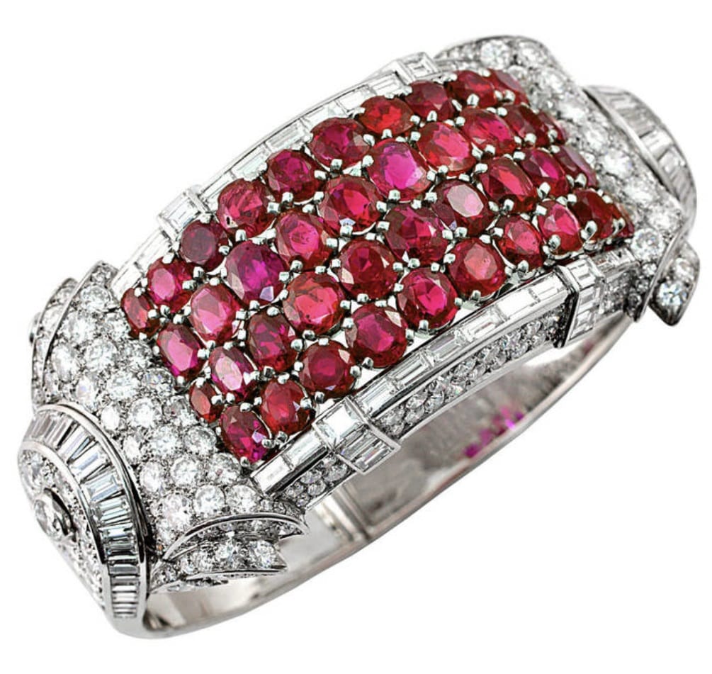 A close-up of a diamond and ruby bracelet Description automatically generated